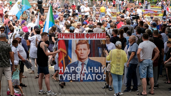 People carry a portrait of Sergei Furgal during protests in Khabarovsk, where he used to be governor