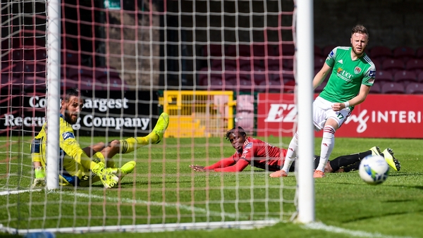 Andre Wright of Bohemians scores his side's first goal past Cork City goalkeeper Mark McNulty