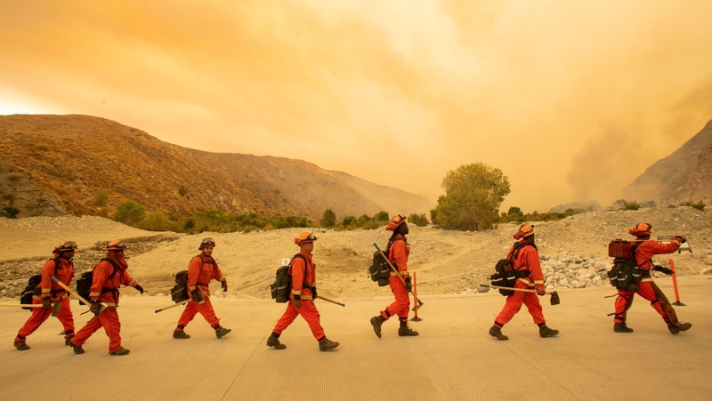 Firefighters arrive at the scene of the Water fire, a new start about 20 miles from the Apple fire in Whitewater, California