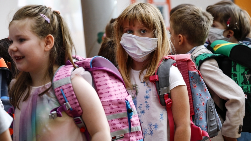 Children wait to enrol for the new term at Lankow school in Mecklenburg-Western Pomerania, Germany