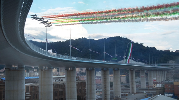 Jets trailing the colours of the Italian flag roar overhead at the inauguration of the Genoa bridge