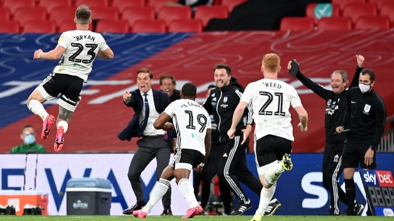 Joe Bryan celebrates with his Fulham team-mates and coaching staff after his Wembley goal