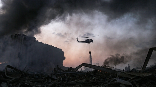 Helicopters are used to help douse the flames