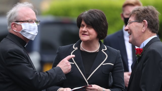 Northern Ireland's First Minister Arlene Foster speaks to Bishop of Derry Donal McKeown and former SDLP MLA Tommy Gallagher outside St Eugene's Cathedral