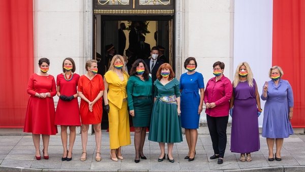 The lawmakers made a statement in brightly coloured clothes and rainbow masks, in a protest against Duda