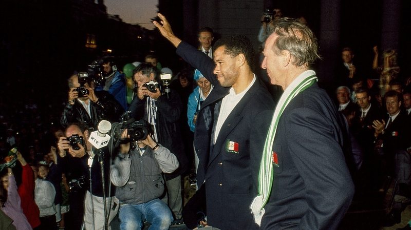Paul McGrath and Jack Charlton salute the crowd at the homecoming in 1990