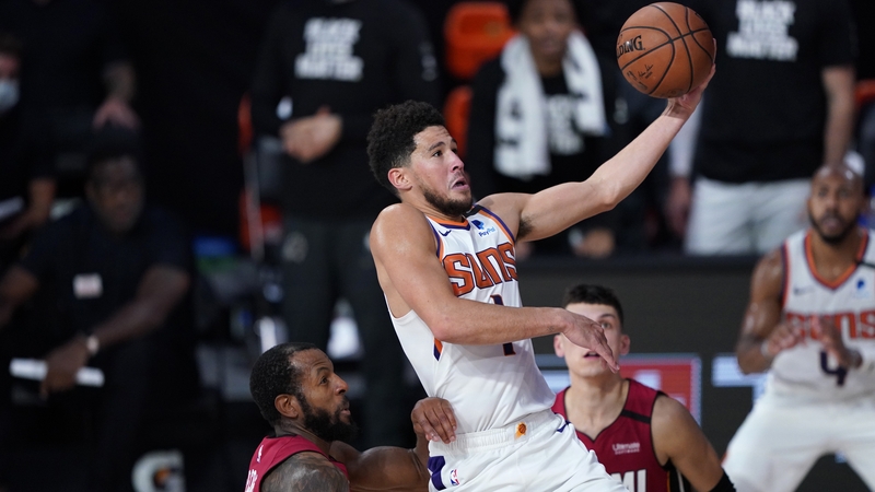 Devin Booker of the Phoenix Suns drives to the basket at Visa Athletic Center
