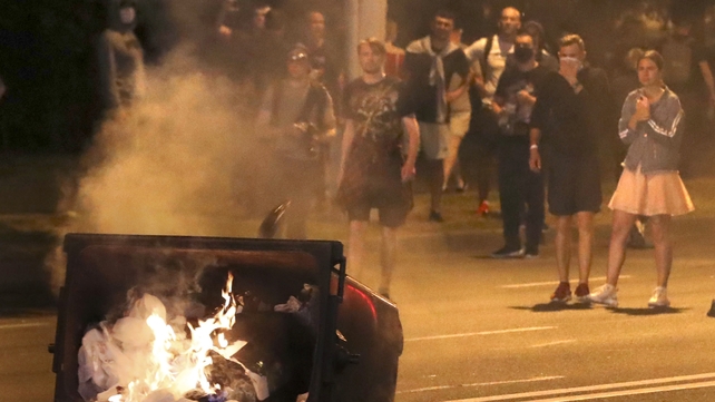 A rubbish bin was set on fire during the protests