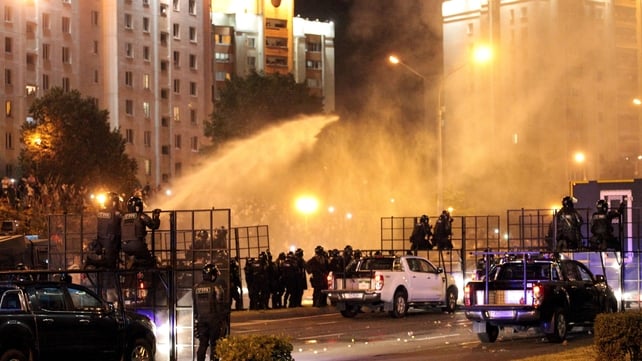 Police use a water cannon against protesters in Minsk