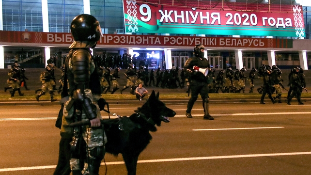 Riot police guard a street during the protest in Minsk