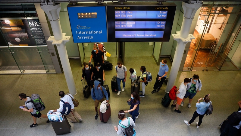 Travellers arrive at St Pancras train station in London