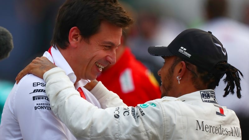 Hamilton has suggested that decisions on his own future could be tied to Wolff's (l) own plans