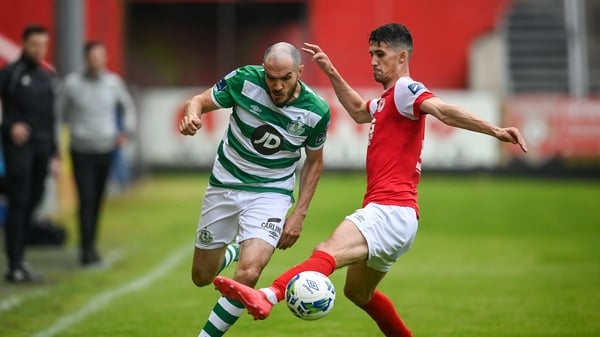 Joey O'Brien of Shamrock Rovers is tackled by Shane Griffin of St Patrick's Athletic