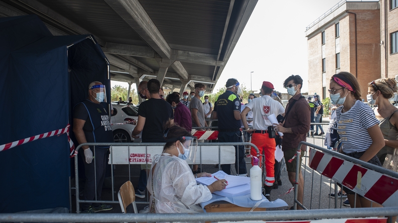 Young people line up for Covid-19 tests in Italy
