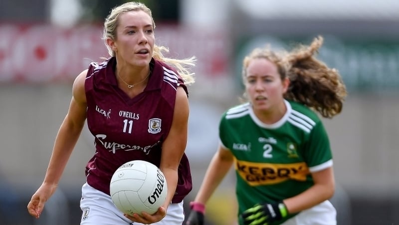 Megan Glynn gets a pass away under pressure from Kerry's Anna O'Reilly during their 2019 All-Ireland Championship clash