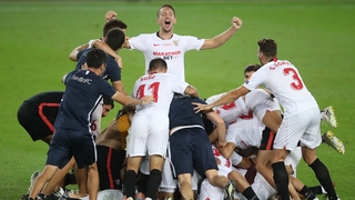 Sevilla players celebrate at full-time