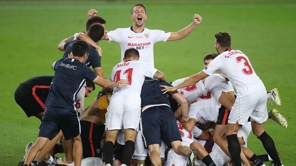 Sevilla players celebrate at full-time
