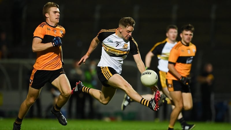 Michael Potts of Dr Crokes solos through ahead of Dylan Casey of Austin Stacks