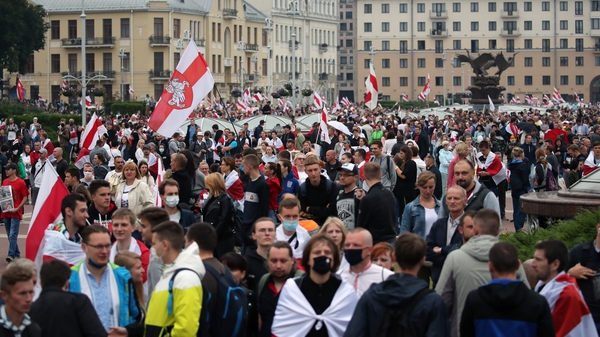 Waving red-and-white opposition flags, protesters demanded Mr Lukashenko's resignation and chanted 'freedom'