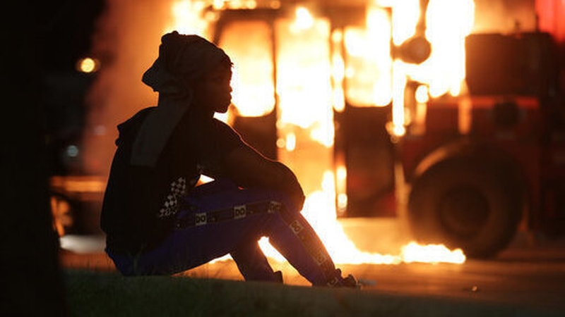 After nightfall in Kenosha, a crowd of protesters faced off against riot police