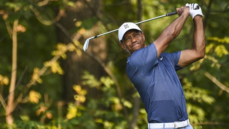Tiger Woods plays his shot from the 17th tee during a practice round on Tuesday ahead of the BMW Championship at Olympia Fields