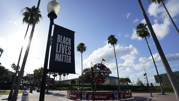 A Black Lives Matter banner hangs outside of the arena in Florida