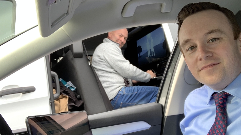 Fran McNulty works on a socially-distanced edit with colleague Jimmy Norman. Reporters now work from their cars alongside the satellite van.