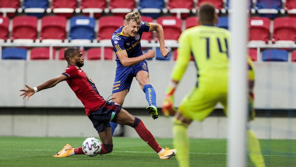Kris Twardek of Bohemians in action against Loic Nego of Fehervar