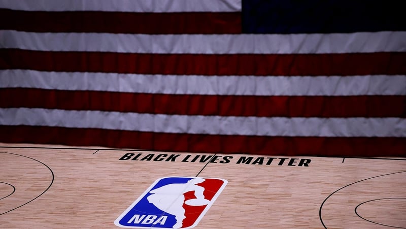 The Black Lives Matter logo seen on an empty court after NBA playoff games were postponed