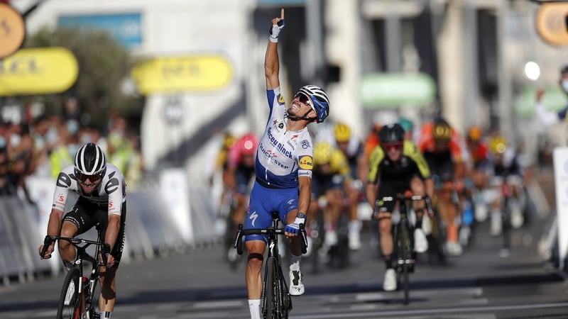Julian Alaphilippe celebrates after beating Marc Hirschi to the line