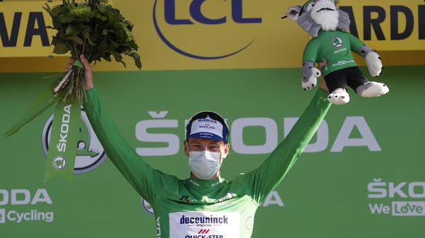 Sam Bennett celebrates on the podium