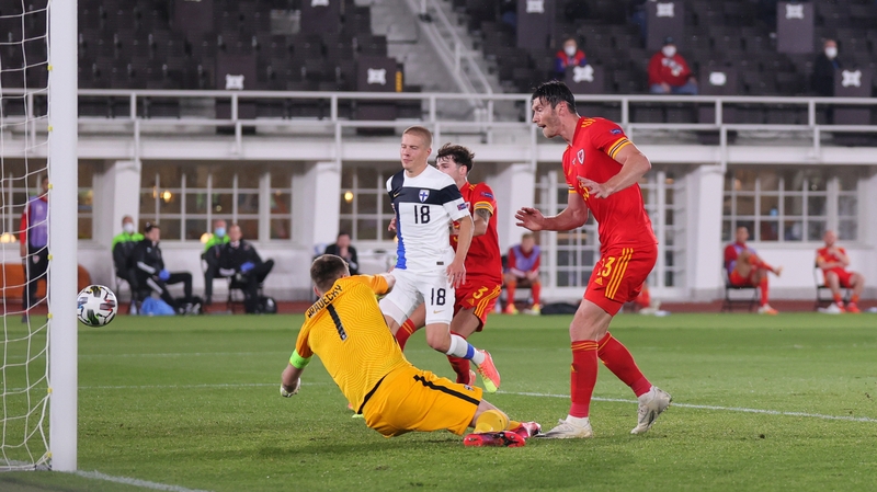 Kieffer Moore beats Finland goalkeeper Jesse Joronen from close range