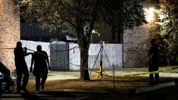 Investigators working at the scene where Michael Reinoehl died
