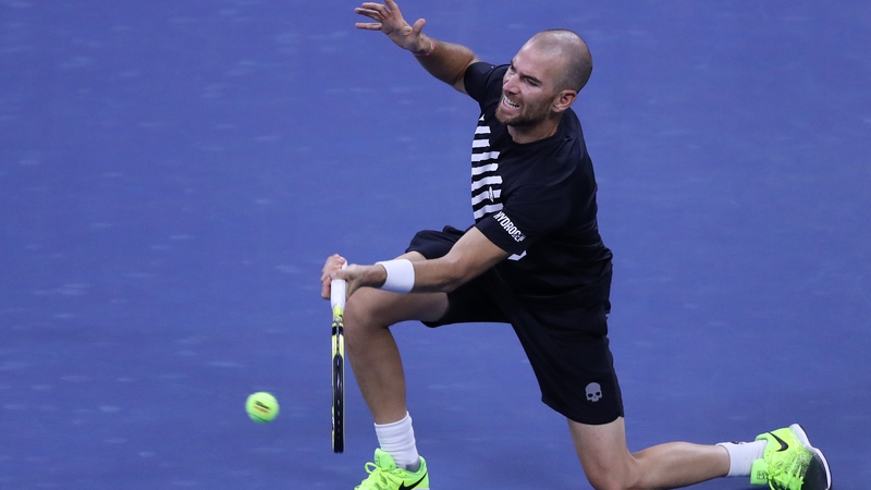 Adrian Mannarino of France returns a volley against Zverev