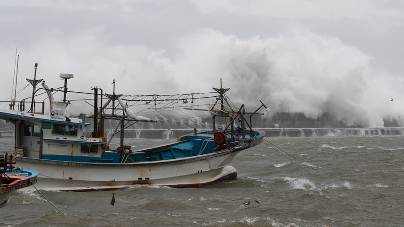 Large waves break over a coastal wall at Imwon harbour in Donnghae, Gangwon-do province, South Korea