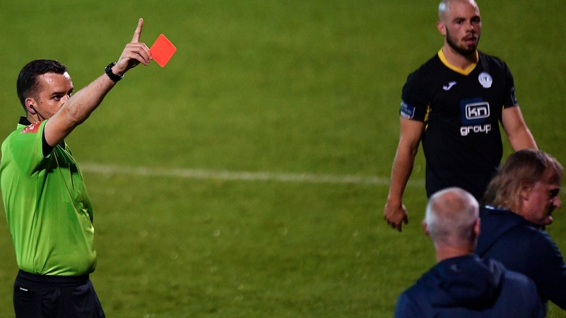 Horgan (r) was sent to the stand by the referee after his side were reduced to 10 men