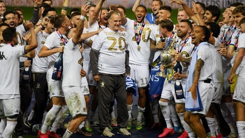 Marcelo Bielsa celebrates the Championship title with his players