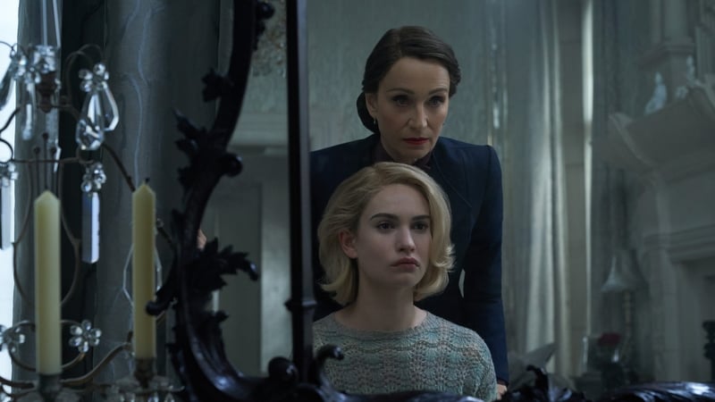 Kristen Scott Thomas as Mrs. Danvers with Lily James as Mrs. de Winter in Rebecca