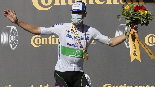 Sam Bennett celebrates on the podium