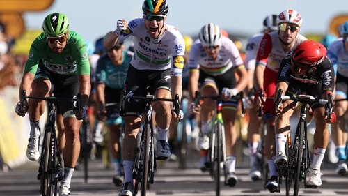Sam Bennett crosses the line in first place