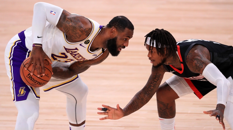 LeBron James of the Los Angeles Lakers is shielded by Ben McLemore of the Houston Rockets