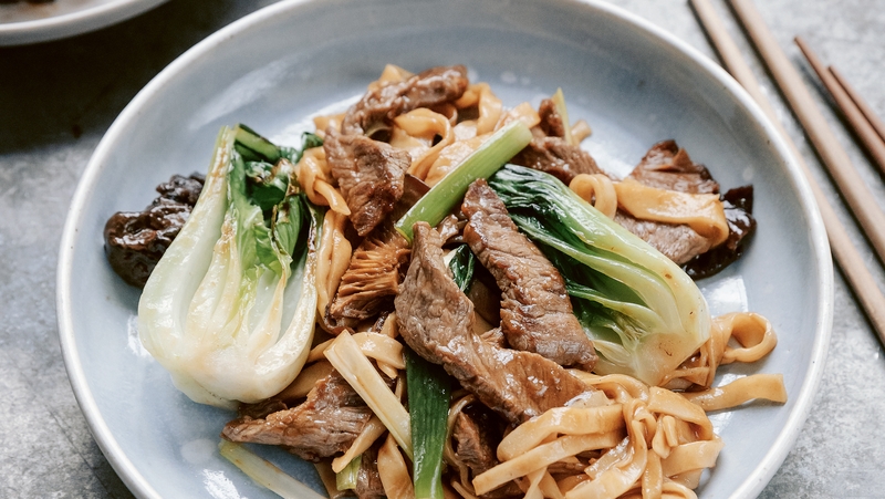 Wok-fried noodles with beef and pak choi for a quick mid-week dinner.