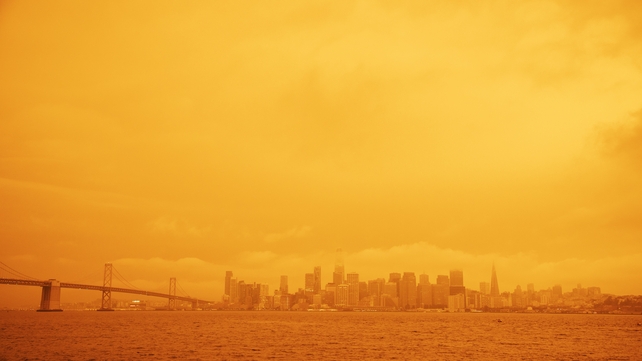 A view of a layer of smoke generated by the over 20 wildfires burning in California created and eerie orange glow over much of the San Francisco Bay Area