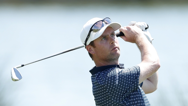 Jonathan Caldwell of Northern Ireland plays his second shot