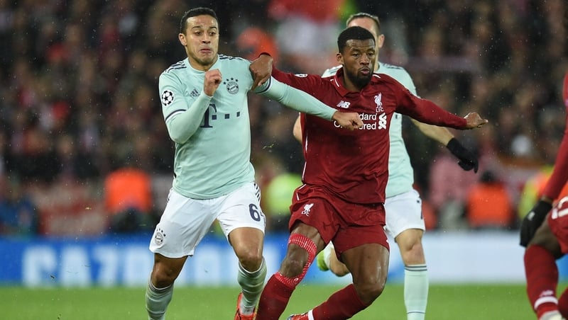 Thiago Alcantara (L) vies with Liverpool's Georginio Wijnaldum during the Champions League in 2019
