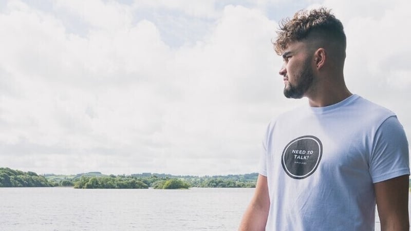 Ronan Patterson wearing a 'Need To Talk' t-shirt