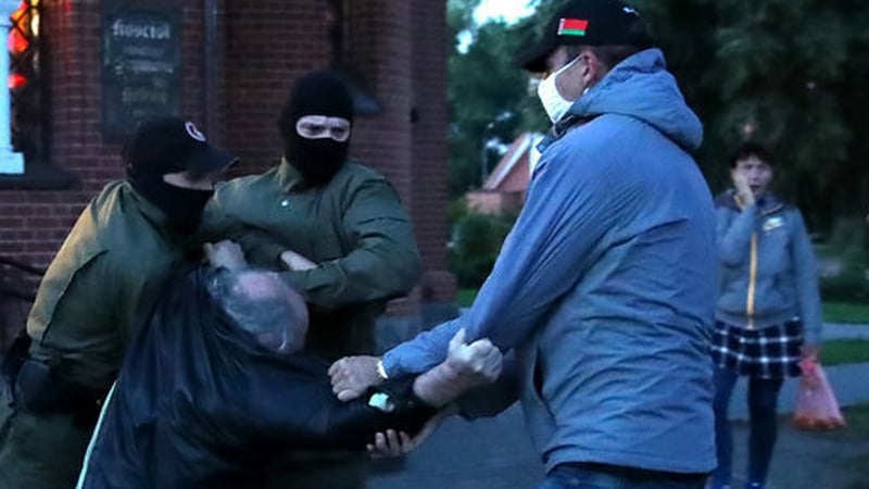 Activists being detained during a rally at St Simon and St Helena Church in Independence Square, Minsk