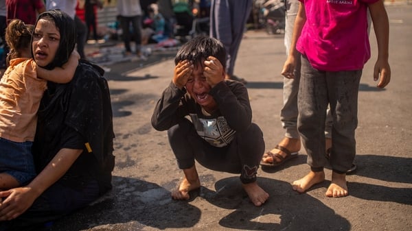 A boy reacts after police fired teargas
