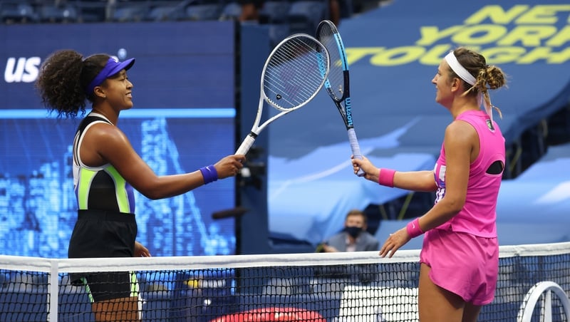 Naomi Osaka is congratulated by Victoria Azarenka