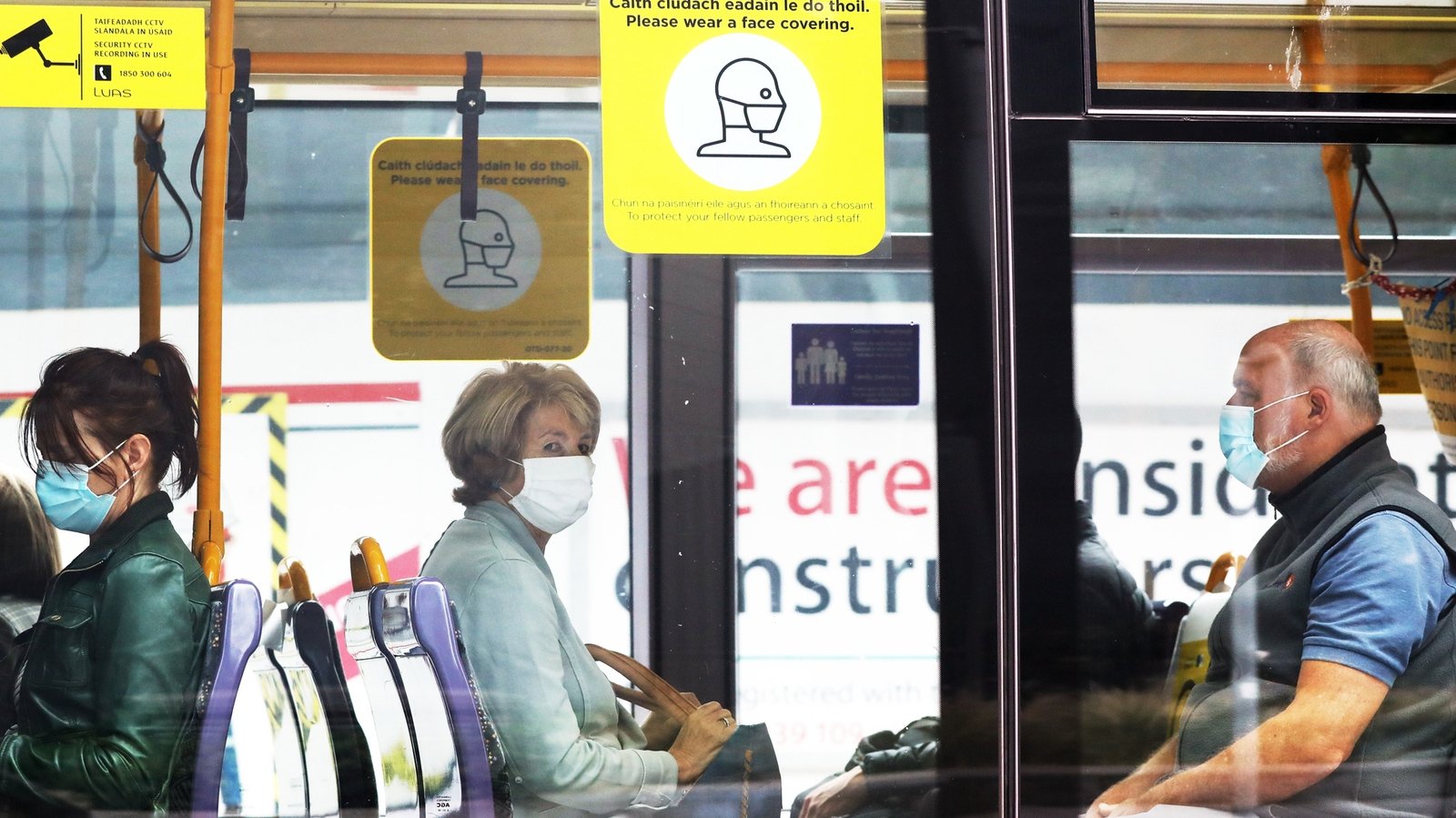 Commuters wearing mandatory face-masks on public transport